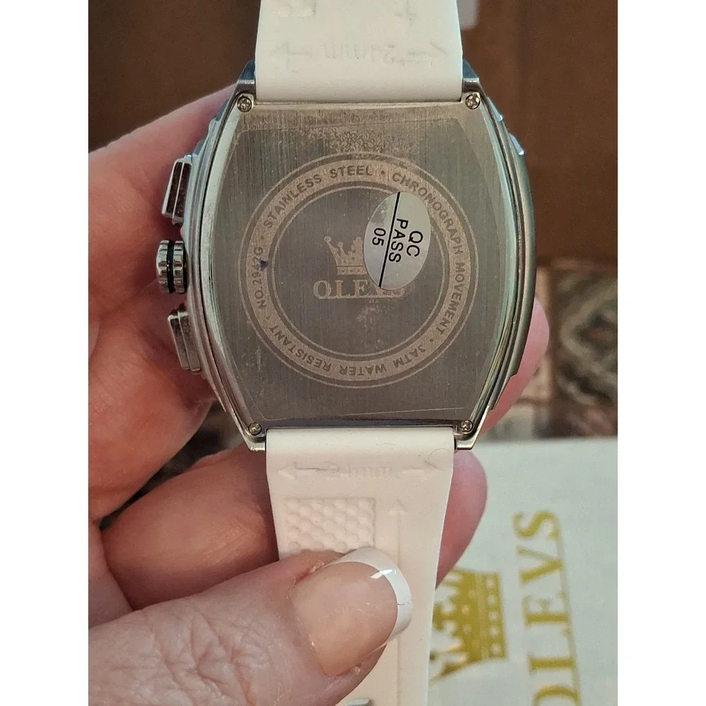 NIB OLEVS 2942G Mens Watch. Chrono W/Moon Phase Calendar,SS Case,White Strap.